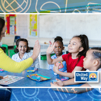 Kids with teacher smiling