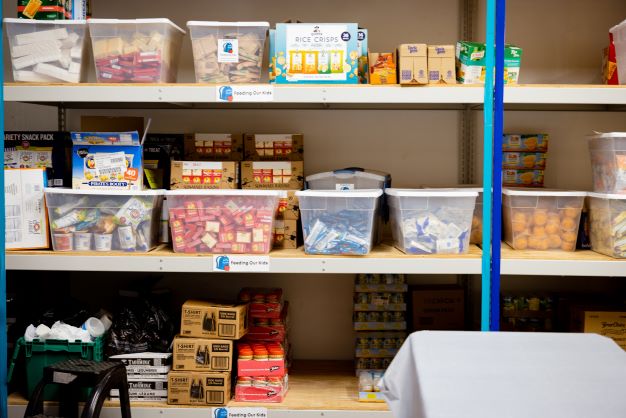 A food pantry with full shelves.