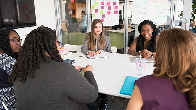 Women sitting around a conference table