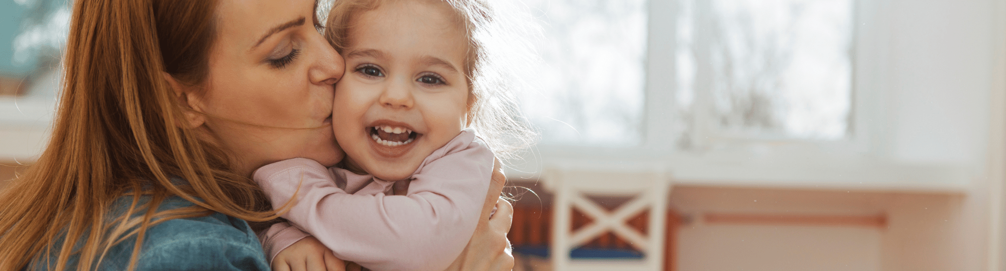 Happy toddler with caring parent