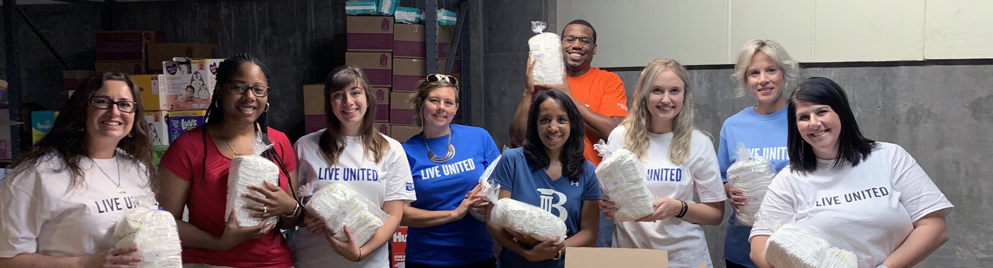 Diaper Bank Volunteers holding diapers