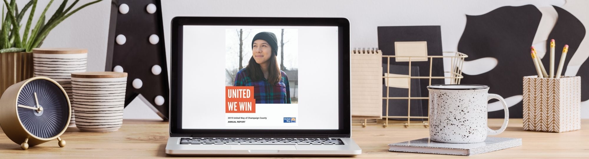 Desk with Annual Report on screen