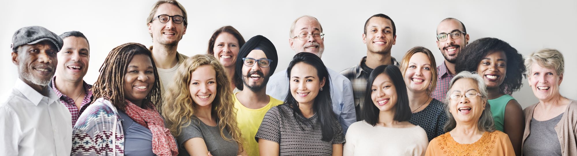 One dozen smiling people of many races and ethnicities