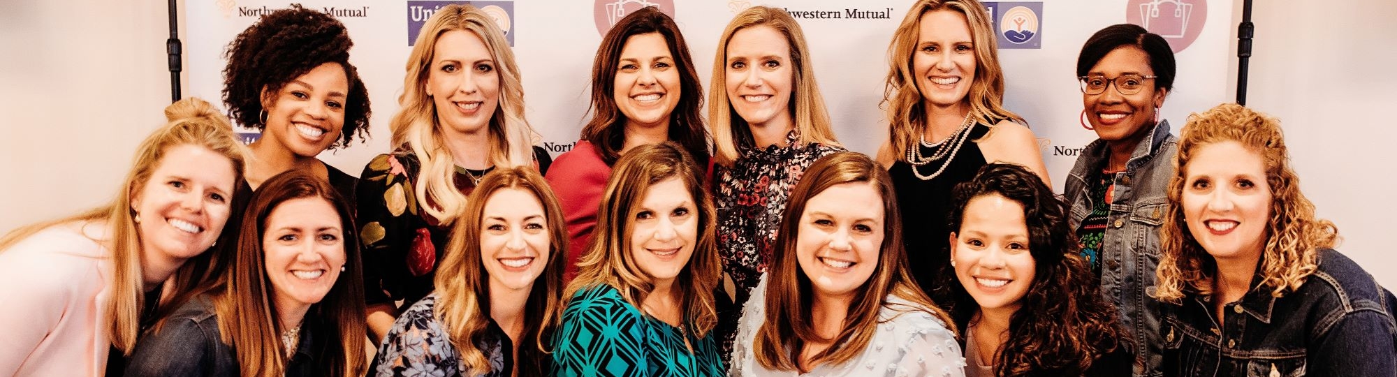 Women United committee members pose for a group photo