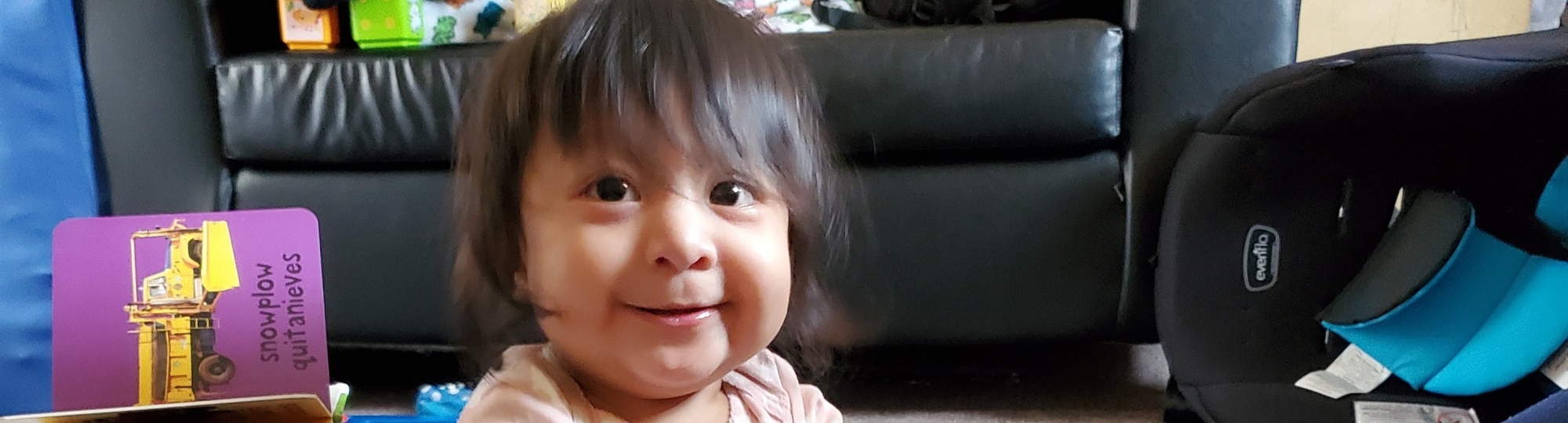 A toddler playing with enriching toys