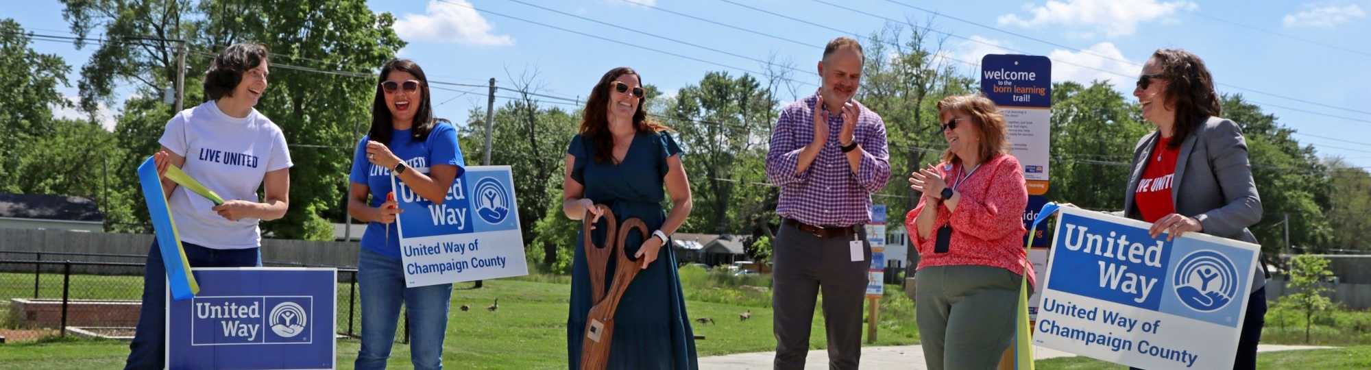 Staff from United way, human kinetics and the Champaign Park District celebrate a ribbon cutting