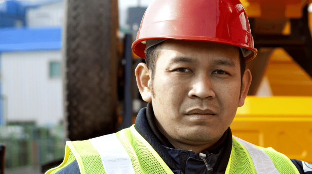 Man in hard hat at a work site
